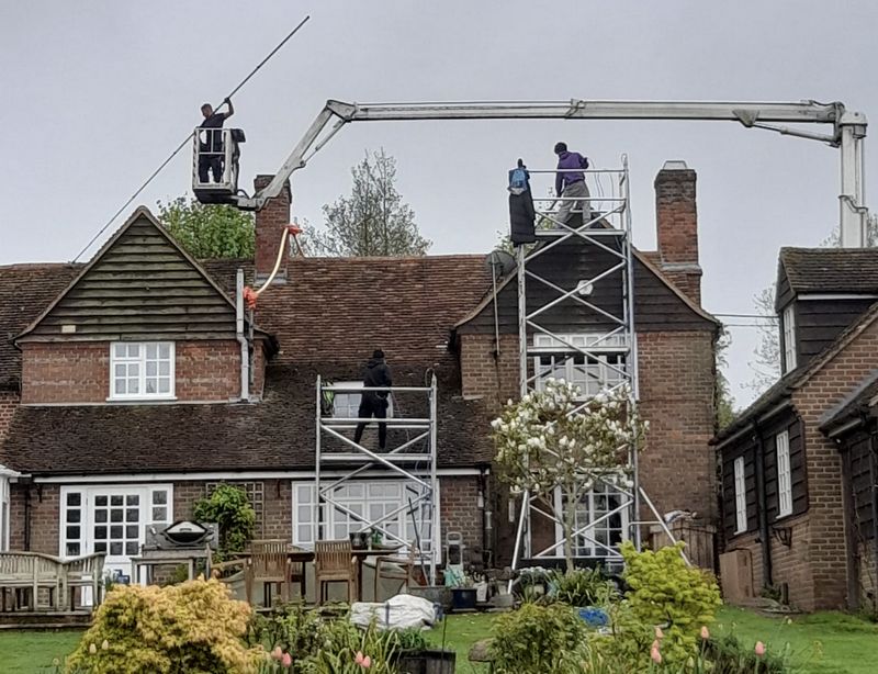 The Roof Moss Cleaners using cherry picker and scaffolding to clean roof safely and professionally in Stubbington, Hampshire
