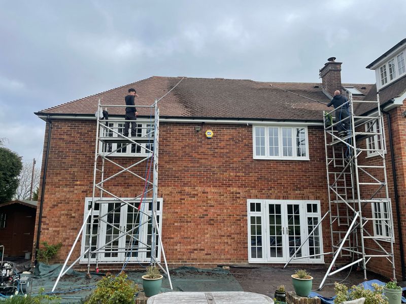 Roof cleaning carried out safely from scaffold towers by The Roof Moss Cleaners in Stubbington